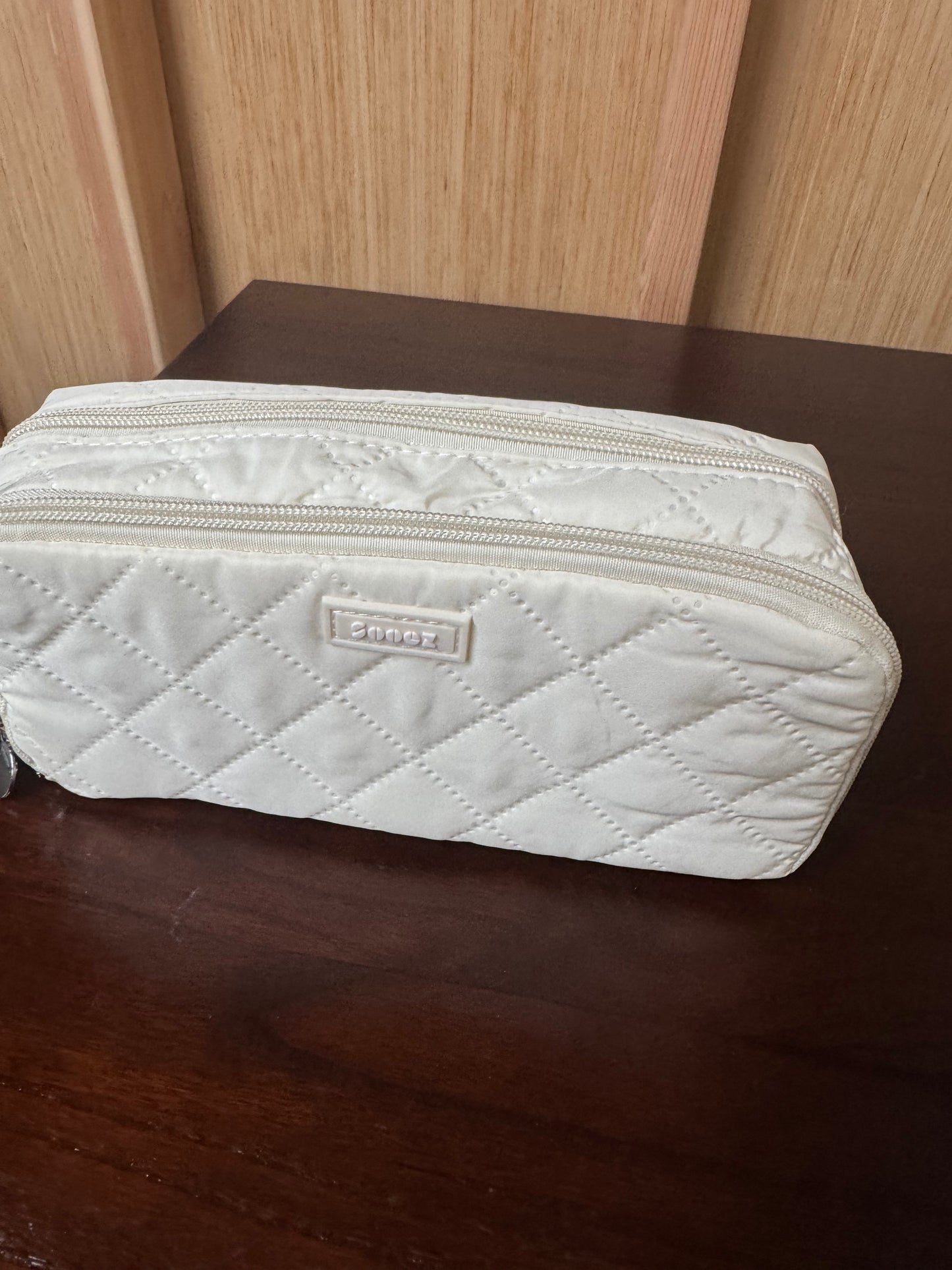 Quilted makeup travel bag